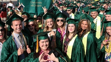 Graduates gather outside Matthew Knight Arena