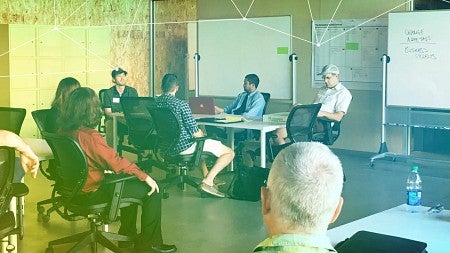 UO interns listen to a speaker