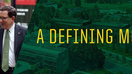 Phil Knight and Michael Schill walk together