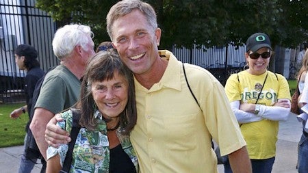 Cover of the 2015 issue of the UO Department of Accounting Prospectus with Helen Gernon and a former student at the alumni tailgate event.