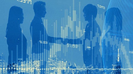 Two groups of people shake hands against the background of a cityscape