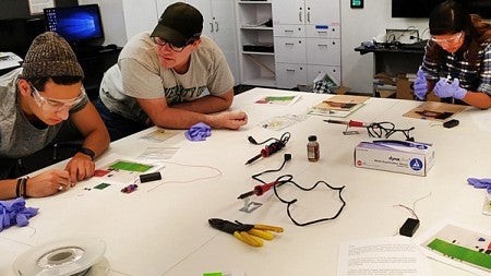 Startup Week attendees work on a project