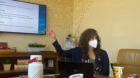 Aliça Diehl gives a presentation to stateholders at the East West Tea Company