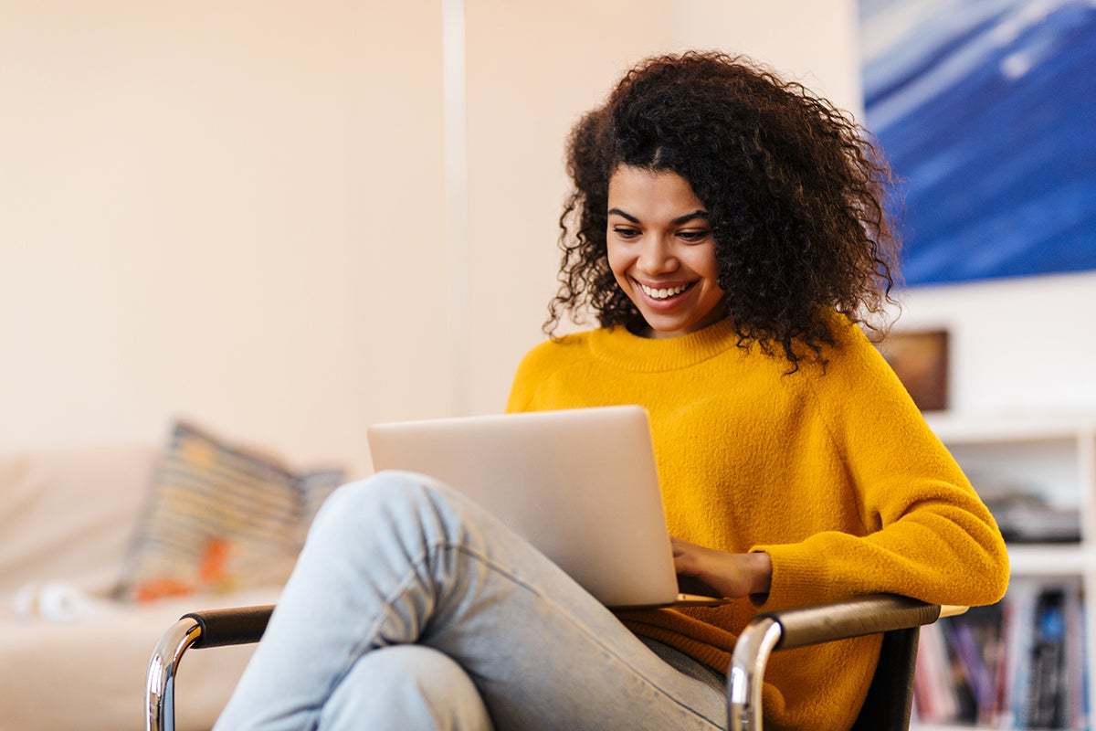 Young woman looking at a laptop