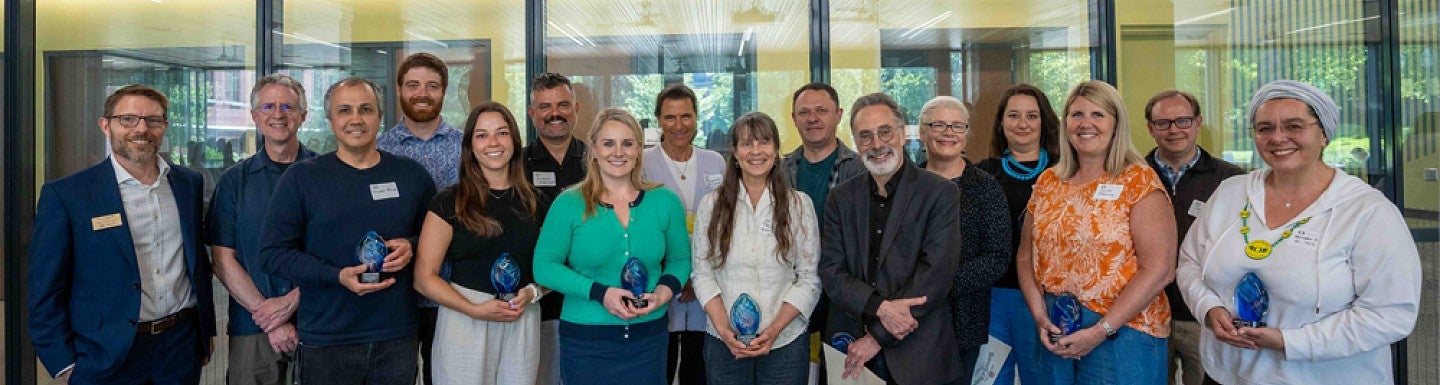 Group of CAS award winners posing together 