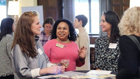 Women discussing subject at a conference