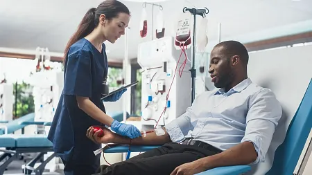 a medical professional works with a patient