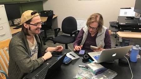 a student works on a laptop