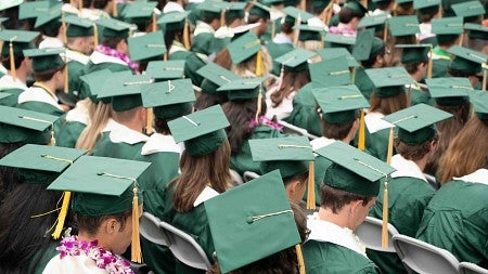 an overview of people wearing green caps