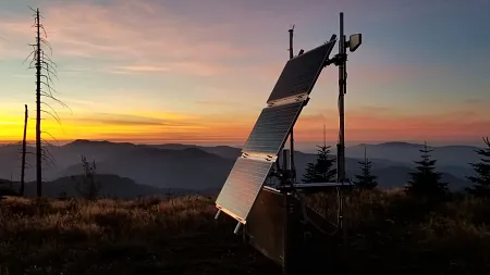 a solar panel over a sunset