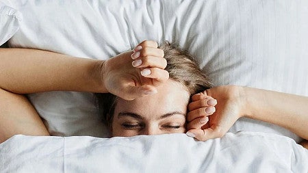 a person sleeping in a bed