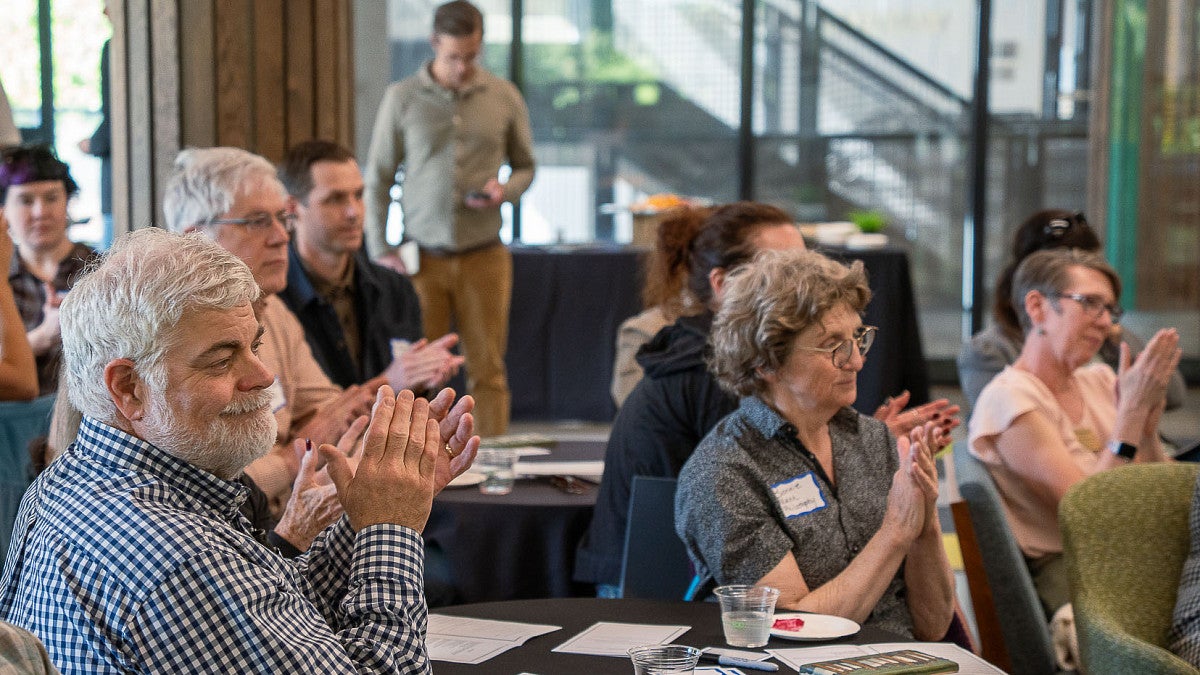 people applauding at an event