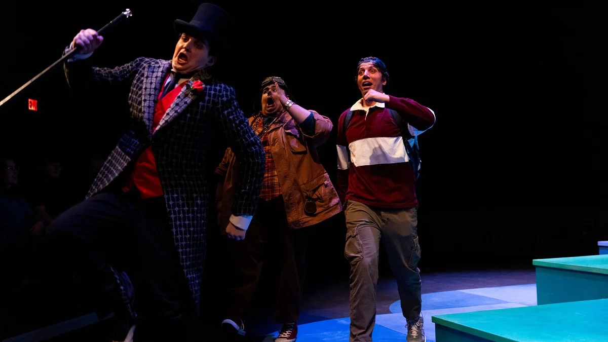 three actors dance and sing on stage for university theatre's performance of phantom tollbooth