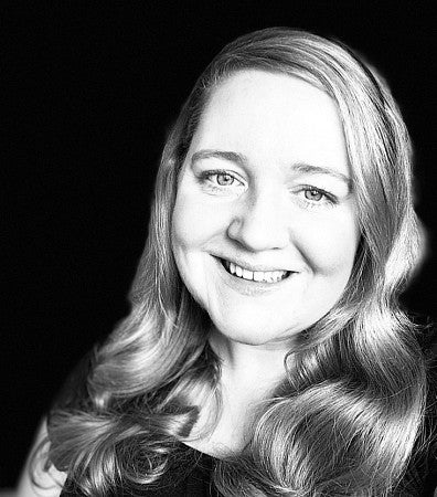 a black and white portrait of Marie Greig
