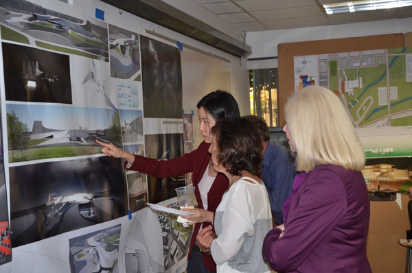Students in “The Beaverton Performing ArtSpace” studio go over designs for a proposed performing arts facility in Beaverton. Photo Courtesy Opsis Architecture. Students in “The Beaverton Performing ArtSpace” studio go over designs for a proposed performing arts facility in Beaverton. Photo Courtesy Opsis Architecture.