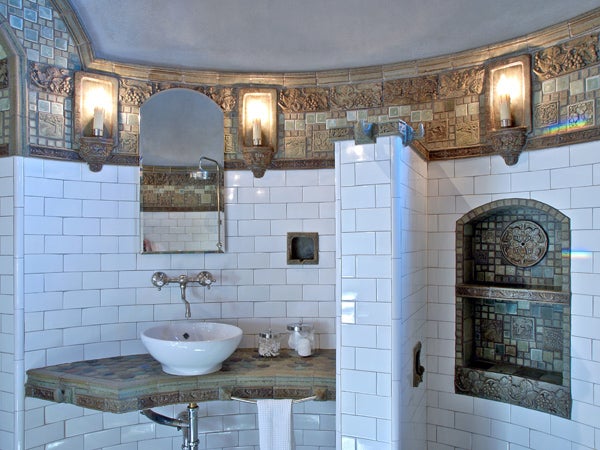 Green tower bath with ceramic fixtures, sconces, and tile (excluding subway tile) by Stephani Stephenson. Design and photograph by Maddux Design in San Antonio, Texas.