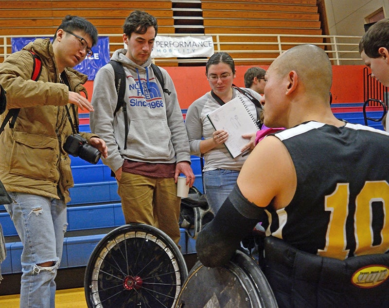 Students listen to Groulx and other players