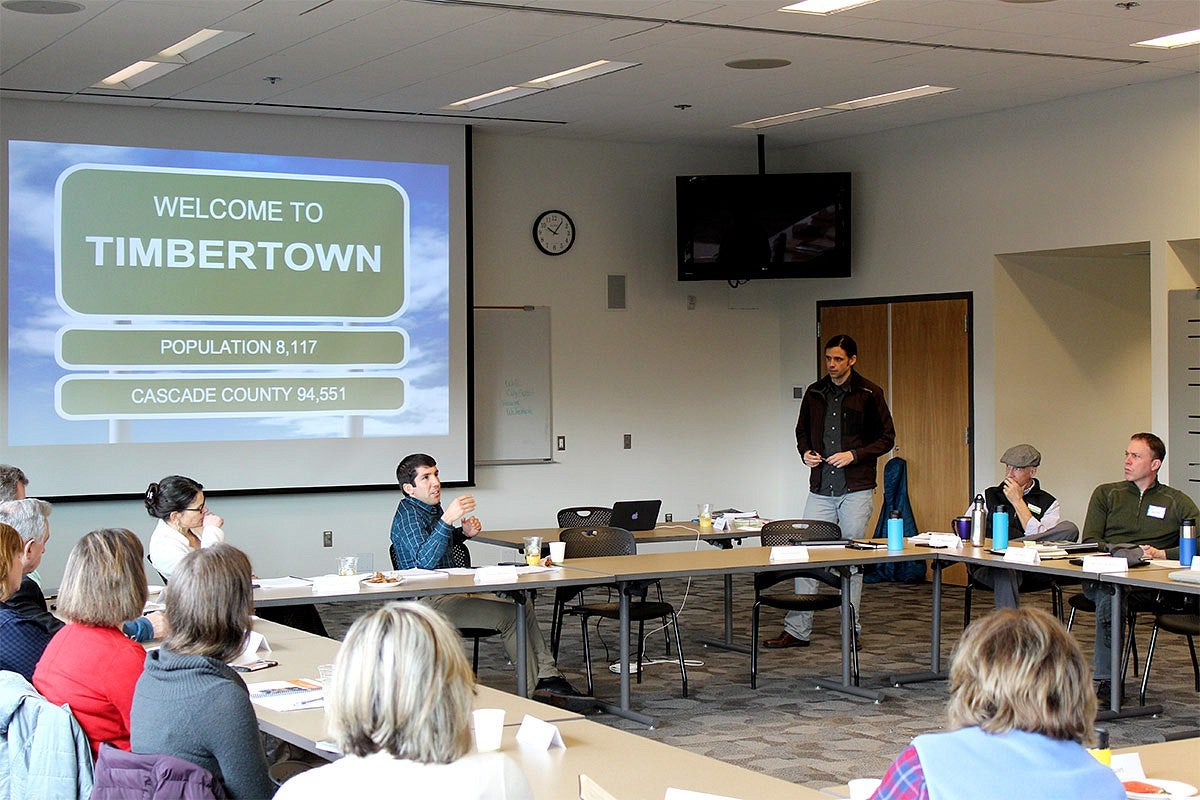 Photo of a person giving a presentation to a group of seated people