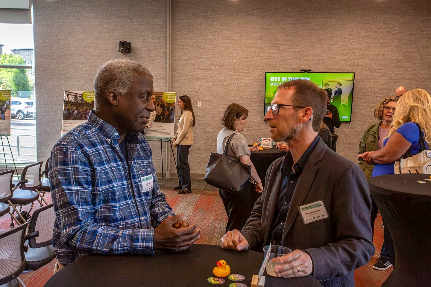 SCYP participating faculty talk during reception. 