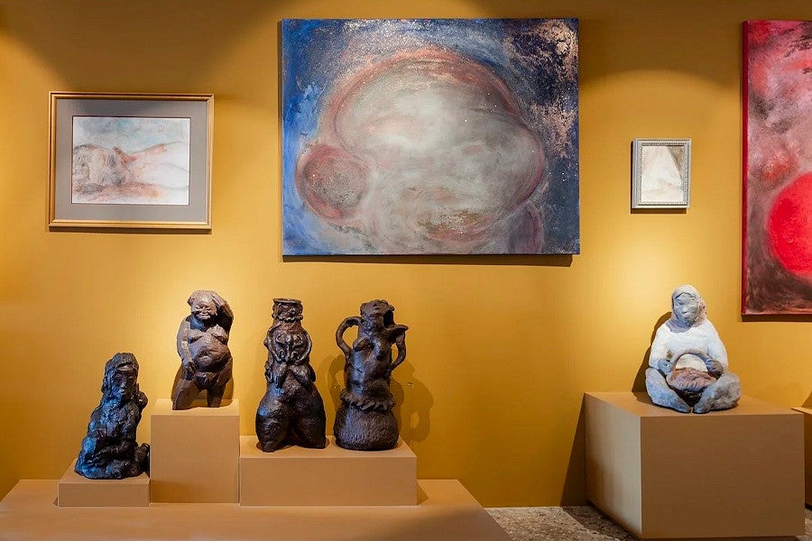 Photograph of the ECC Biennale showcasing both the Dean's paintings and Liu Shiming's sculptures. Click to read more. 