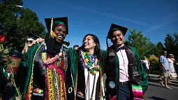 Commencement speaker and Lawrence Medal recipient is Ed Cain. Photo provided is of three students at commencement.
