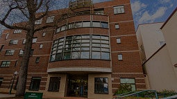 Darkened photo of the front of Lawrence Hall.