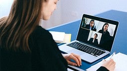 photo of a woman at a laptop