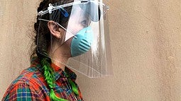 Student Geordi Helmick wearing a face shield