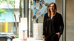 Nicole Epple with lamps and Illuminating Engineering Society of Oregon scholarship check