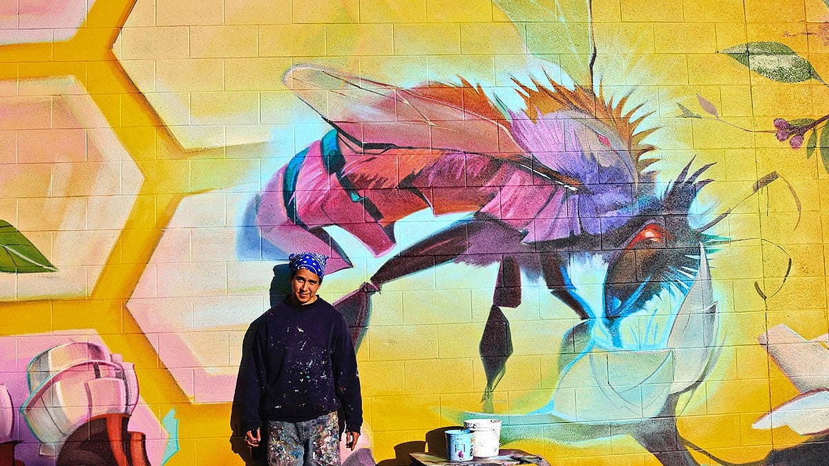 Artist Steve Lopez with Mural