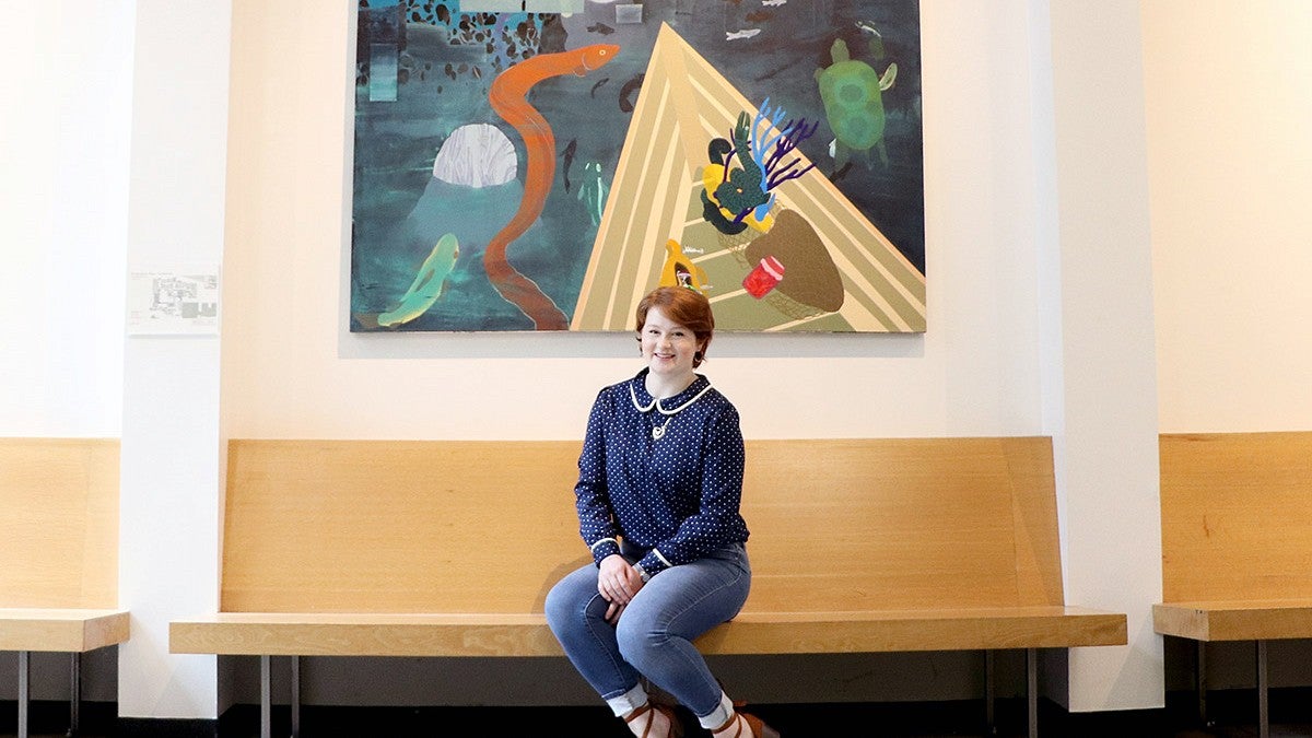 Art History Student Katelyn Jones in front of a painting