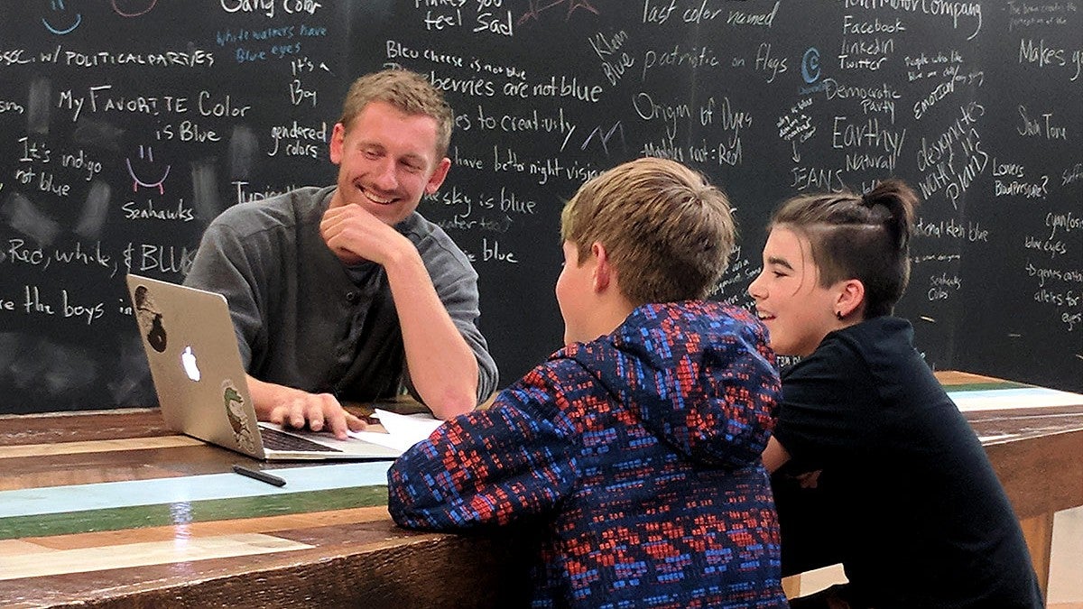 Mentor Trevor McClelland, gets to know students during the Product of Eugene kick-off event. Photo courtesy Lane Arts Council.