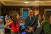 Photograph of UO President Karl Scholz talking with SCYP Communications lead Lindsey Hayward 