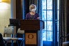 Photograph of a masked speaker at the SCYP kick-off.