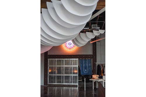 paper cutouts hang from ceiling