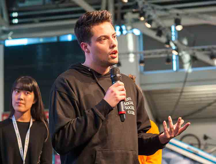 click to enlarge Nick Cantrell speaks into microphone