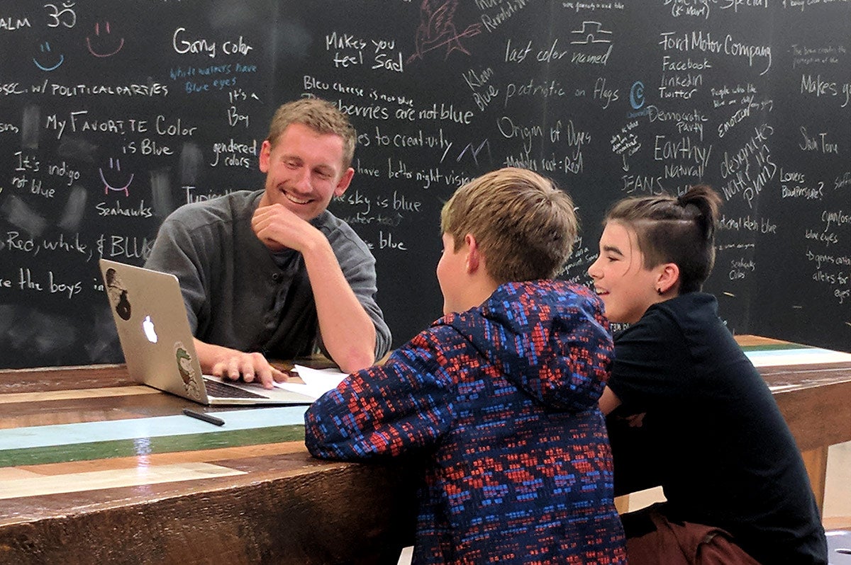 click to enlarge image Mentor Trevor McClelland, gets to know students during the Product of Eugene kick-off event. Photo courtesy Lane Arts Council.