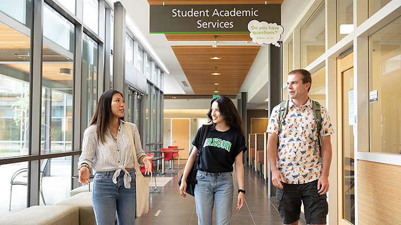Students walking down HEDCO hallway