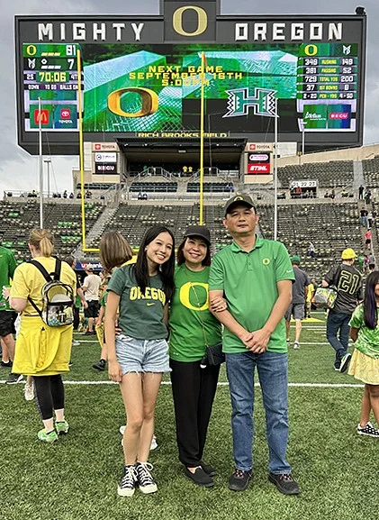 Mia Ly at UO stadium with parents