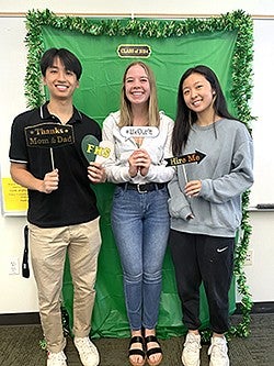 Claire Gosslee, UO Alumni on grad day with friends