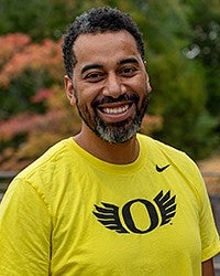 Iton Udosentata in a yellow UO Ducks t-shirt