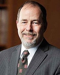 professional headshot of Kevin Reed
