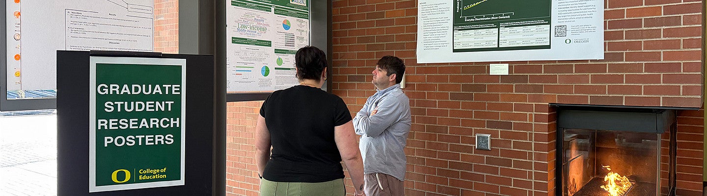 individuals in the HEDCO lobby at the Graduate Student Research Poster Presentation