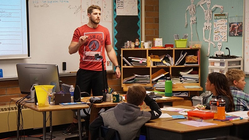 student teacher Erwin Hunter in classroom with young individuals
