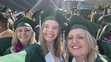 Claire Gosslee, UO Alumni on grad day with friends