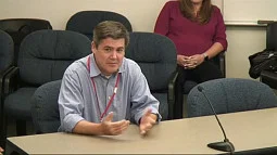 image of David Allen sitting looking away from camera