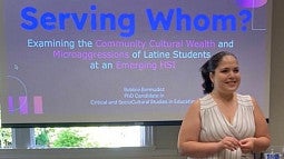 image of student Bobbie Bermudez in front of a display screen