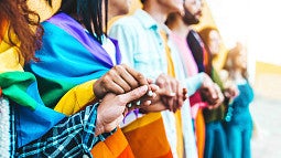 image of multiple diverse individuals holding hands