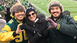 image of UO alumni Bryan Rojas-Arauz at a UO football game with friends