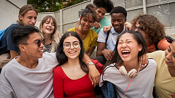 image of multiple individuals in a group laughing and smiling